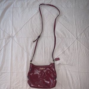 COACH red glossed crossbody purse.